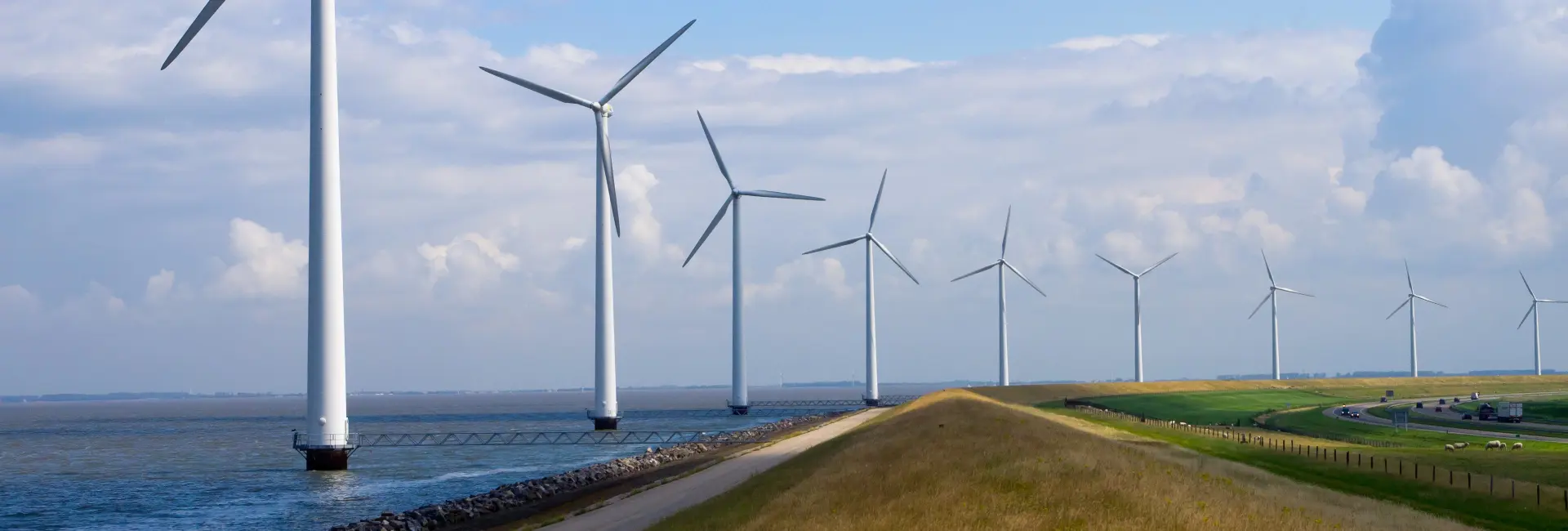 Wind turbines against blue sky